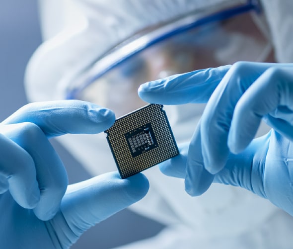 person holding chip in lab