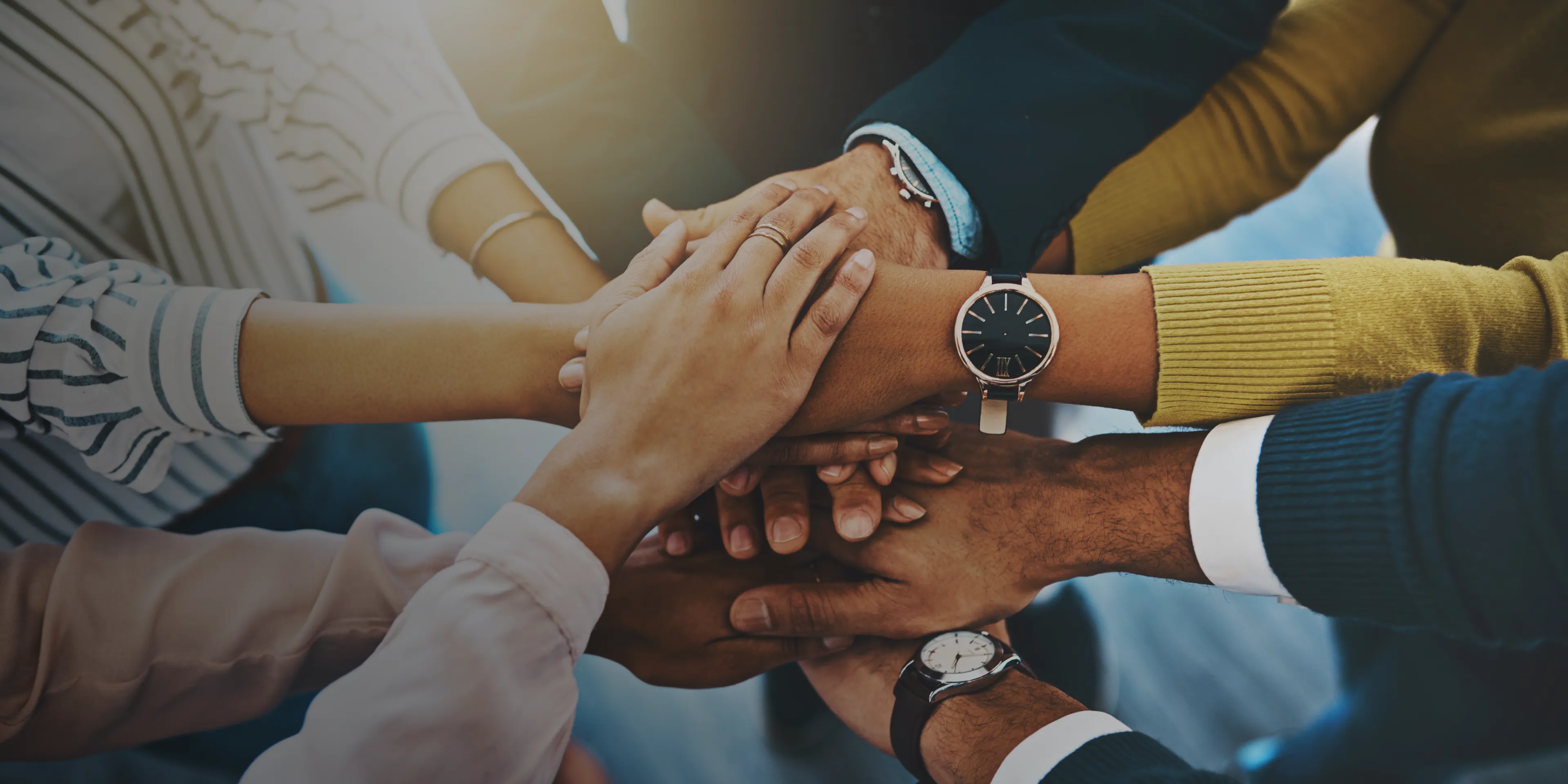 group people circle stacking hands