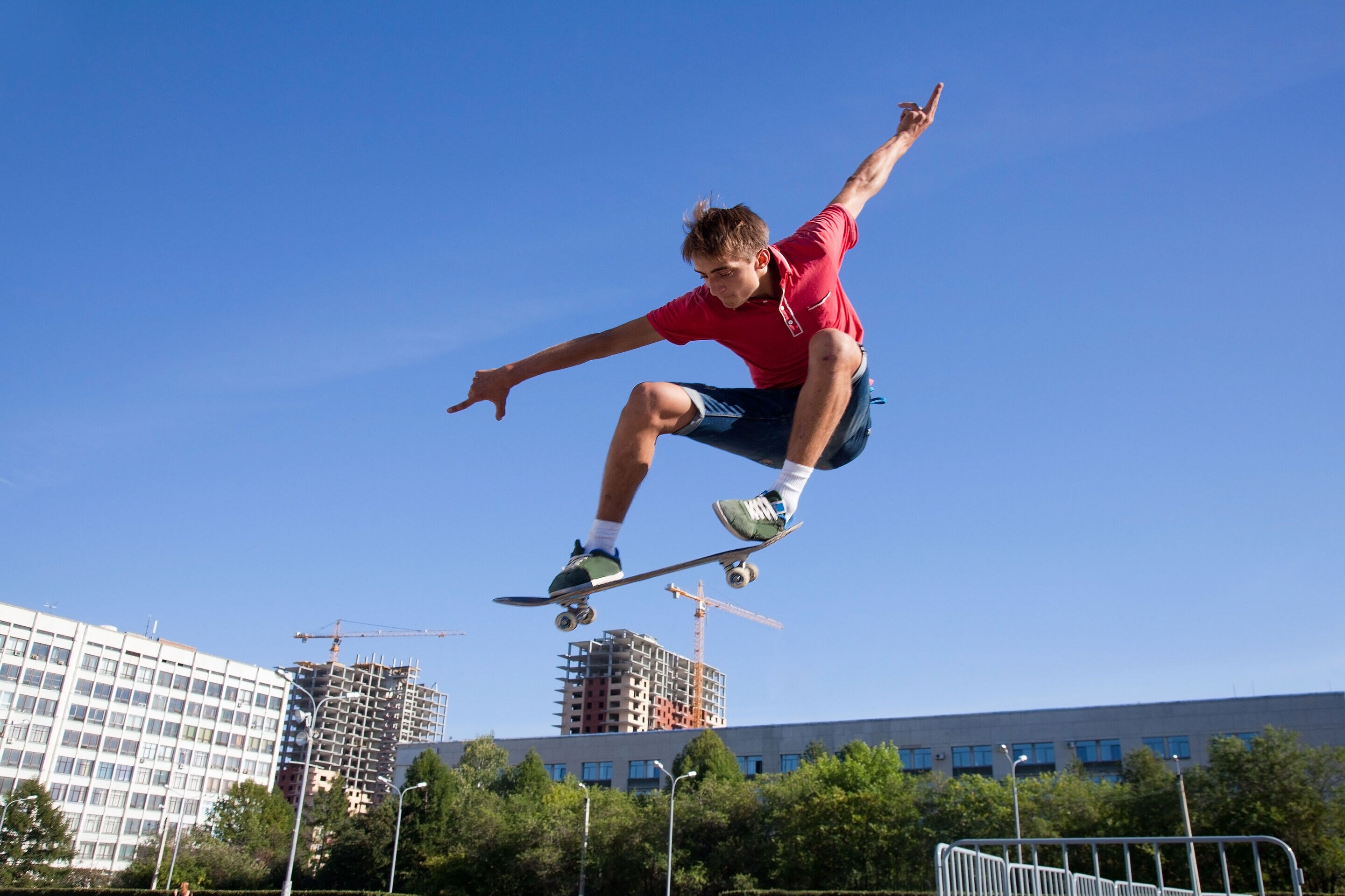 Skateboarder in mid-air performing a trick.