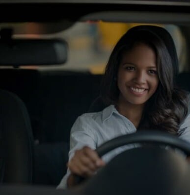 smiling woman driving
